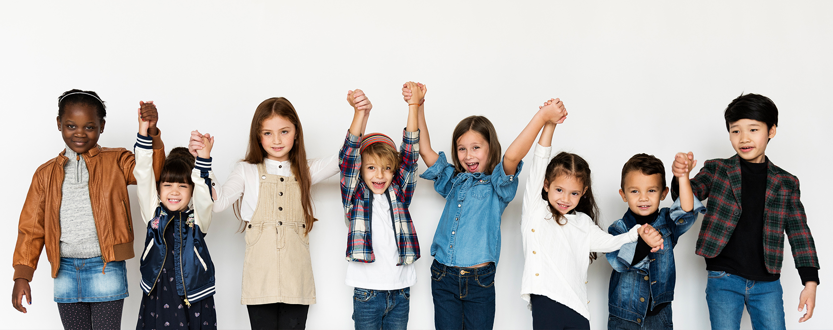 children holding hands up above their heads, dentist in euless