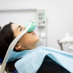 woman using dental sedation nitrous oxide at the dentist